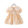 Baby girl yellow polka dot dress with ruffle Peter Pan collar, puff sleeves and peach gingham check – front view